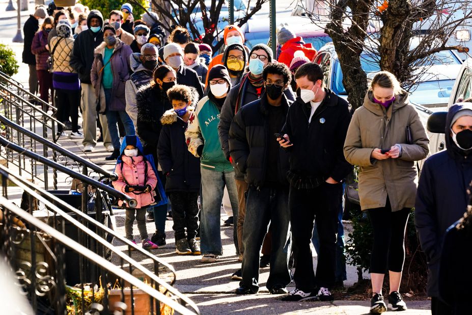 People in Philadelphia wait in a line to receive free at-home test kits on December 20.