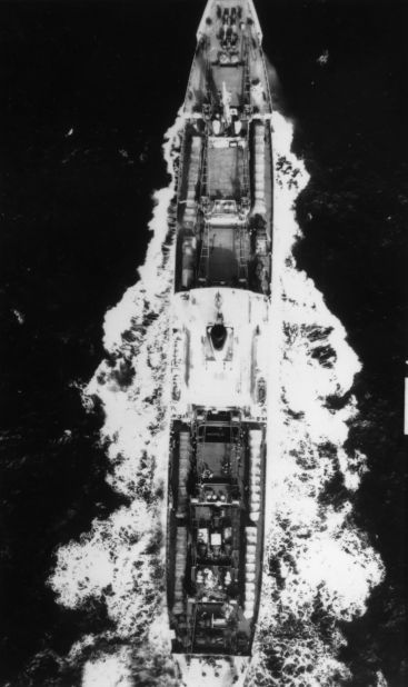 The Soviet cargo ship Fizik Kurchatov leaves Cuba en route for Russia in 1962, during the Cuban missile crisis. On deck are six canvas-covered missile transporters with missiles.