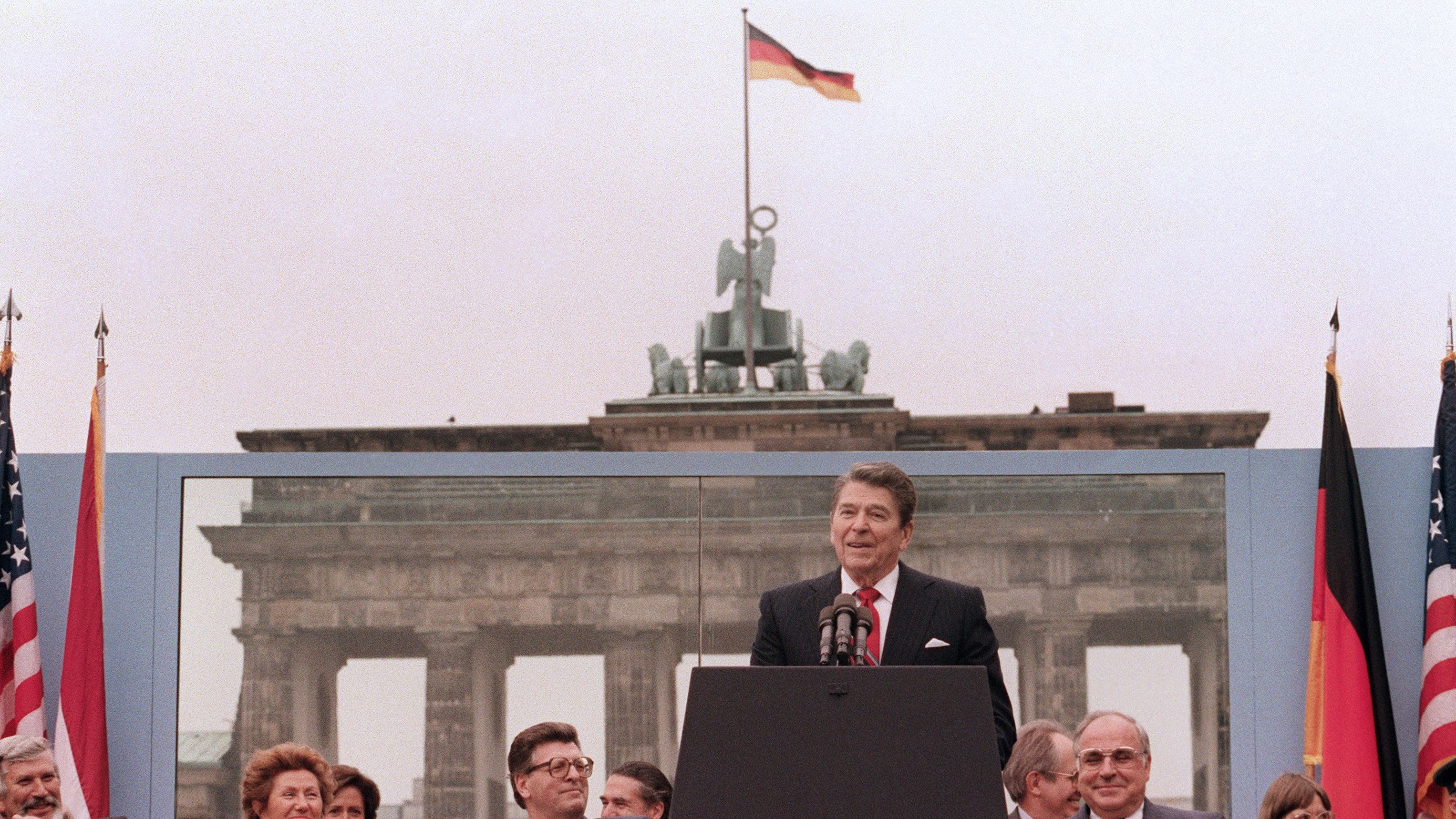 US President Reagan, commemorating the 750th anniversary of Berlin, addresses the people of West Berlin at the base of the Brandenburg Gate, near the Berlin Wall on June 12, 1987. Due to the amplification system being used, the President's words could also be heard on the Eastern (communist-controlled) side of the wall. "Tear down this wall!" was the famous appeal by Reagan, directed at Gorbachev, to destroy the Berlin Wall. The address Reagan delivered that day is considered by many to have affirmed the beginning of the end of the Cold War and the fall of the Soviet bloc. 