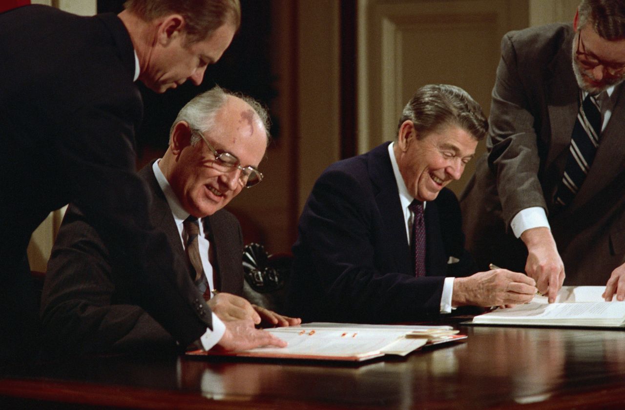 President Reagan and Soviet leader Mikhail Gorbachev sign the arms control agreement banning the use of intermediate-range nuclear missiles in December 1987.