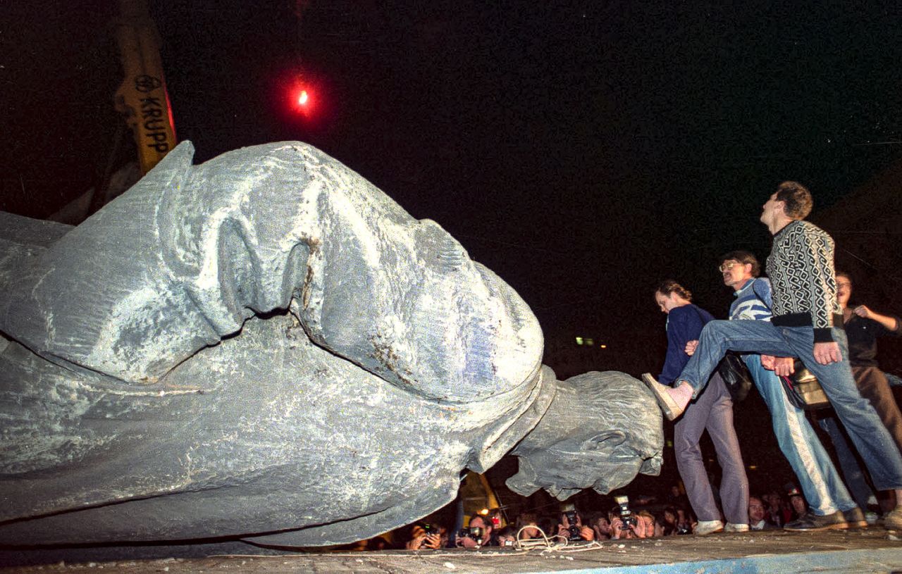 Jubilant people step on the head of the statue of Felix Dzerzhinsky, the founder and chief of the Soviet secret police, later known as KGB, which was toppled in front of the KGB headquarters in Moscow on August 23, 1991. The KGB was responsible for mass arrests and executions.
