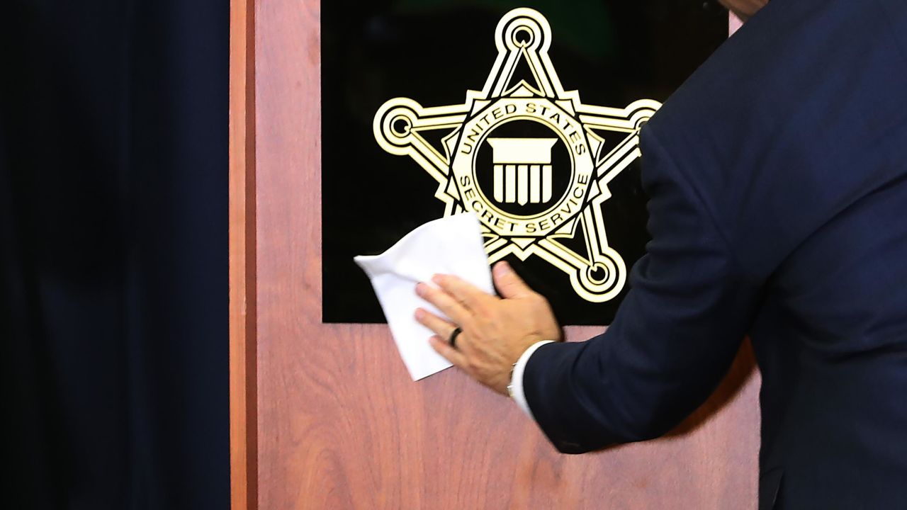 In this November 7, 2019, file photo, a sign with the US Secret Service shield is cleaned before a briefing at the service's headquarters in Washington. 