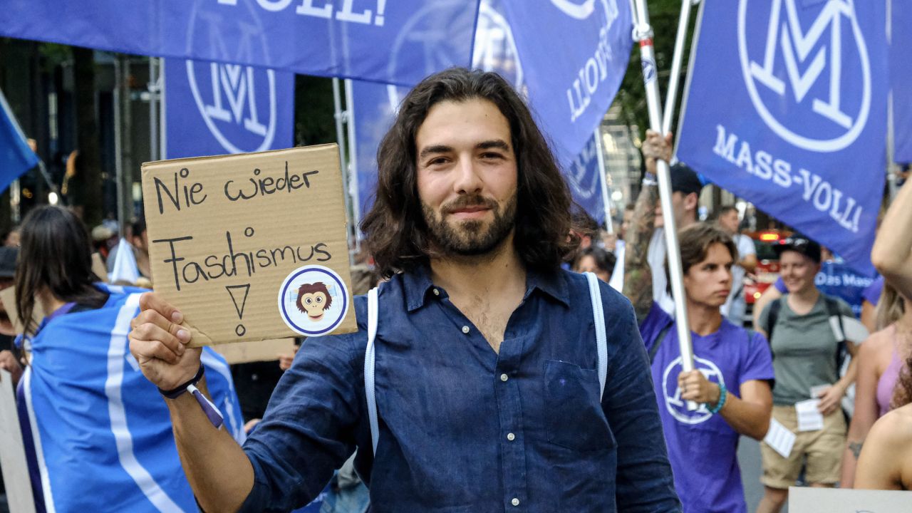 Nicolas Rimoldi at a protest this year. He says his movement, which campaigns against vaccine passports, is "not anti-vax" and that people who have been vaccinated attend its demonstrations.