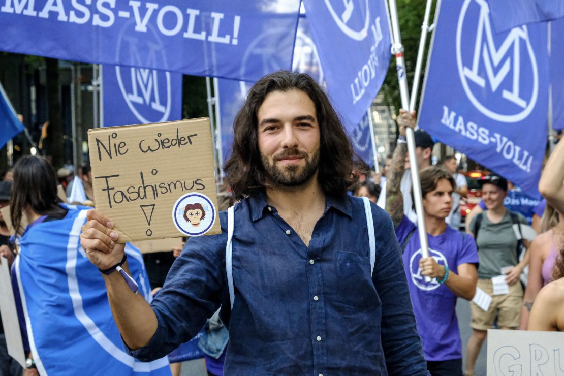 Nicolas Rimoldi at a protest this year. He says his movement, which campaigns against vaccine passports, is "not anti-vax" and that people who have been vaccinated attend its demonstrations.
