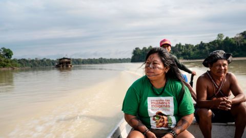 Alessandra Korap of the Munduruku tribe conducts a boat patrol on the Jamanxim River with Chief Juarez, 61, while monitoring illegal mining on Indigenous land in the Amazon.