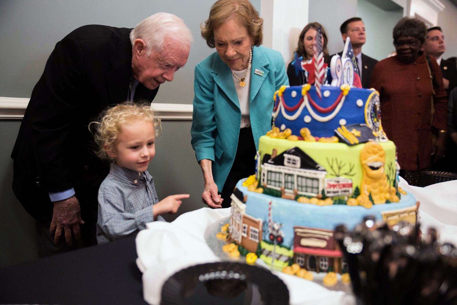 The Carters are joined by their 4-year-old grandson Errol at Jimmy's 90th birthday celebration in Americus, Georgia, in 2014.