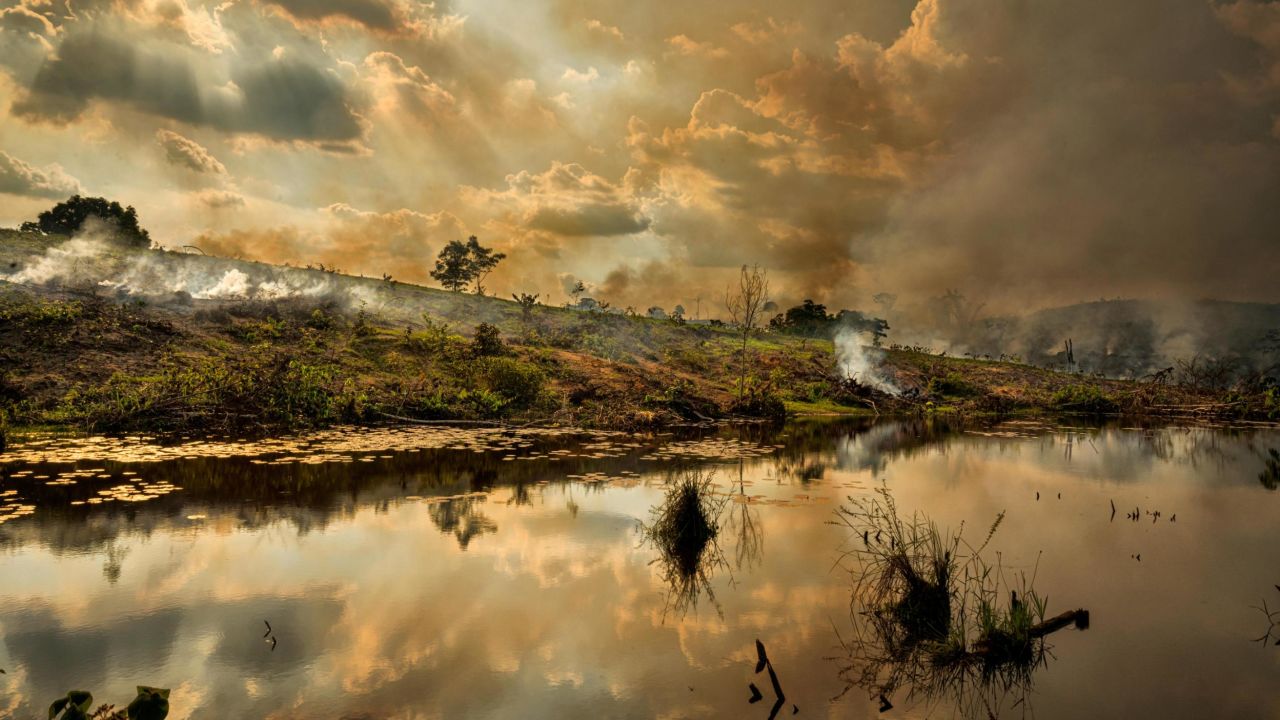 Fires burn in September along the Trans-Amazonian Highway near the Aripuanã National Forest, in the state of Amazonas in Brazil. Deforestation continues at an extraordinary rate in the Amazon, led by land clearing for meat producers and cattle ranchers, along with illegal mining. The most common means of deforestation is by fire, when ranchers burn the land in order to create farms to raise and graze cattle.