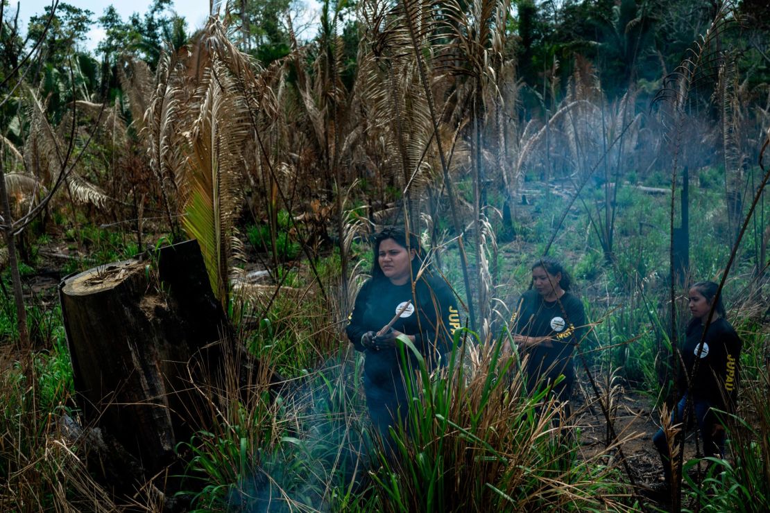 Tejubi Uru eu Wau Wau walks through Indigenous land owned by her tribe near Montenegro in Rondônia. Parts of her tribe's land has been burned for cattle ranching. "I feel saddress when I enter this land. This is land that our ancestors gave us," Tejubi said. "It's hard to express how I feel."