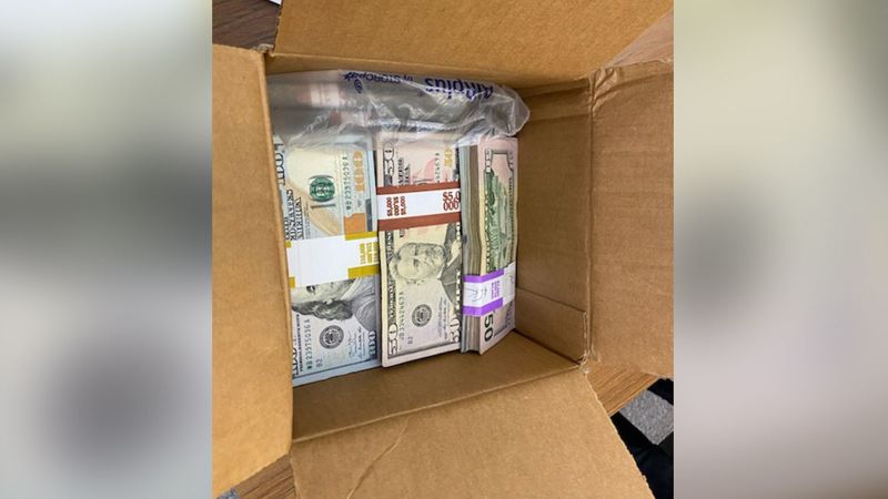 Cardboard box filled with a $180,000 cash donation mailed to The