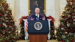 President Joe Biden speaks about the COVID-19 response and vaccinations, Tuesday, Dec. 21, 2021, in the State Dining Room of the White House in Washington. 