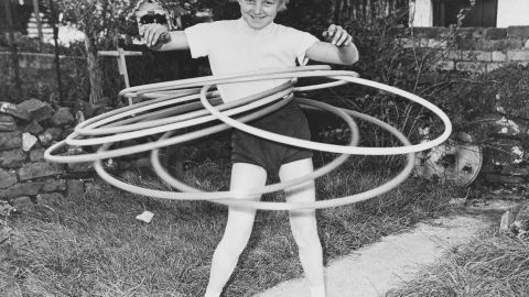 Eleven-year-old Ann Evans of Wales was the world hula hoop marathon champion, seen here twirling seven hoops simultaneously in 1958.