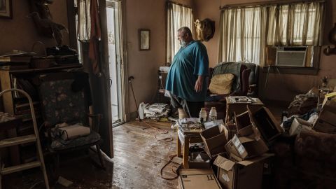 Michael Wilson stands in the doorway to his flood-damaged home after Hurricane Ida made landfall as a Category 4.