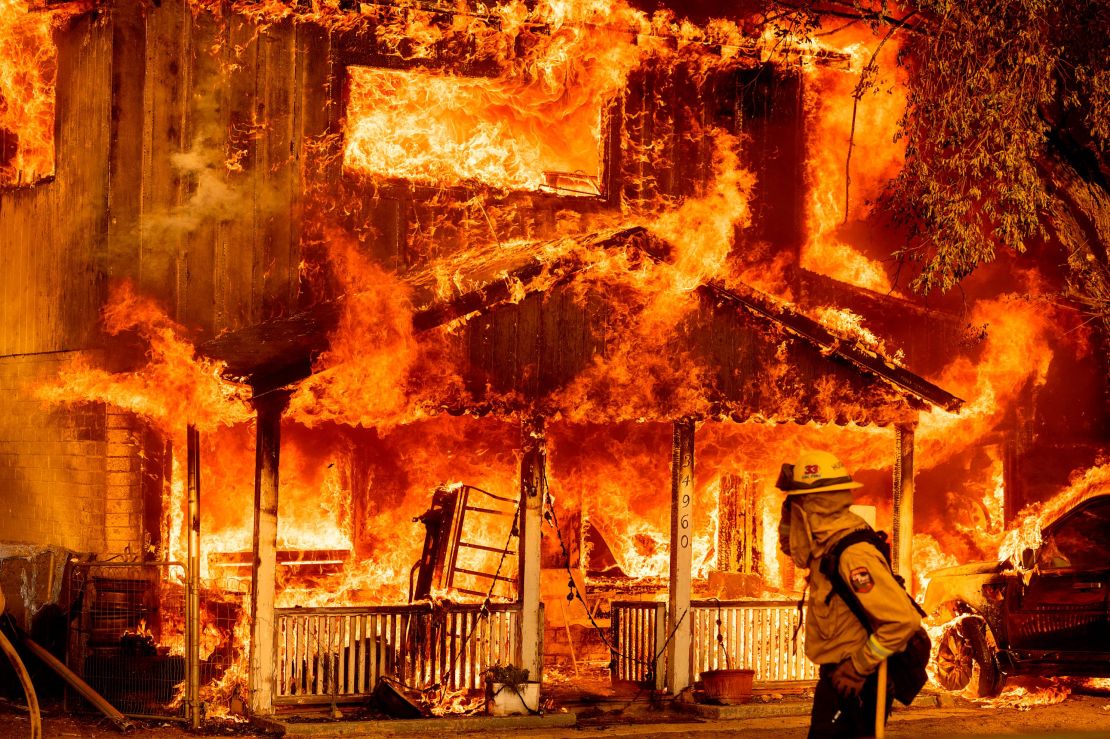 A home is engulfed in flames as the Beckwourth Complex Fire tears through Doyle, California, on July 10, 2021. 