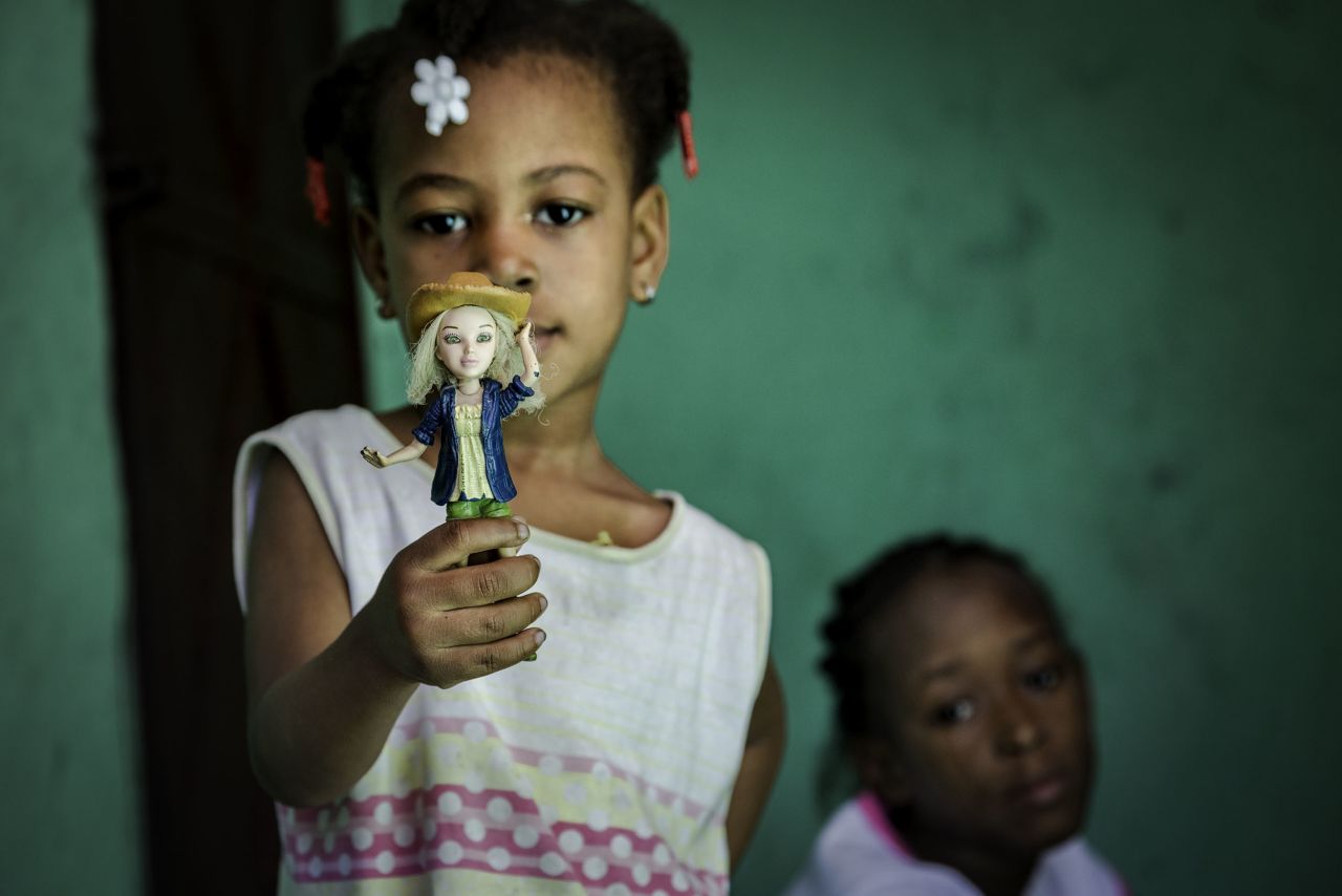 A 2015 image from Haiti that the photographer named "Playing Dolls, Inheriting the Family Toy."