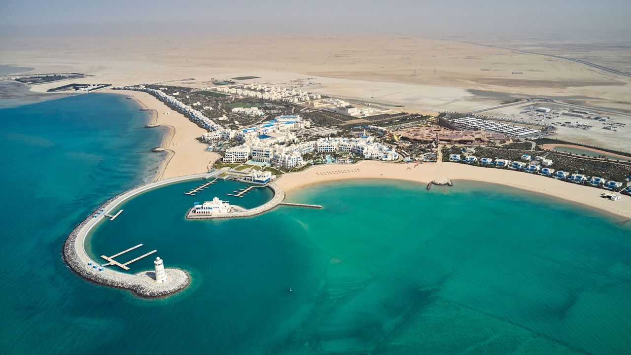 <strong>Aerial view: </strong>Seen from above, the Hilton Salwa Resort & Villas resembles a small town built around a harbor and twin beaches. 