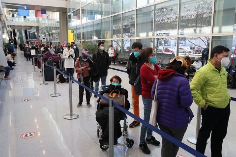 Travelers line up for Covid-19 testing at Boston's Logan International Airport on December 20. 