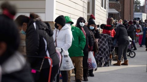 Residents wait in line to receive free Covid-19 at-home test kits on Tuesday in Chelsea, Massachusetts.