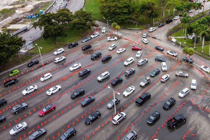 Cars line up at a testing site at Miami's Tropical Park on December 21.