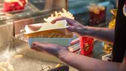 A box of McChoco Potato is seen being prepared in the kitchen on January 25, 2016 in Tokyo, Japan. The McChoco Potato, McDonald's Japan's special winter menu, French fries covered in chocolate and white chocolate sauces will be available in McDonald's restaurants on January 26, 2016 until around mid February.  