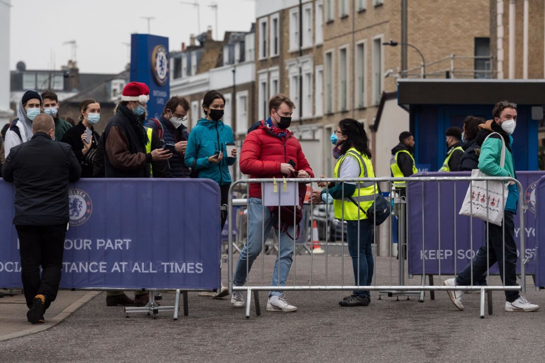  People arrive at a Covid-19 mass vaccination hub at Stamford Bridge, which aimed to administer 10,000 jabs on December 18.