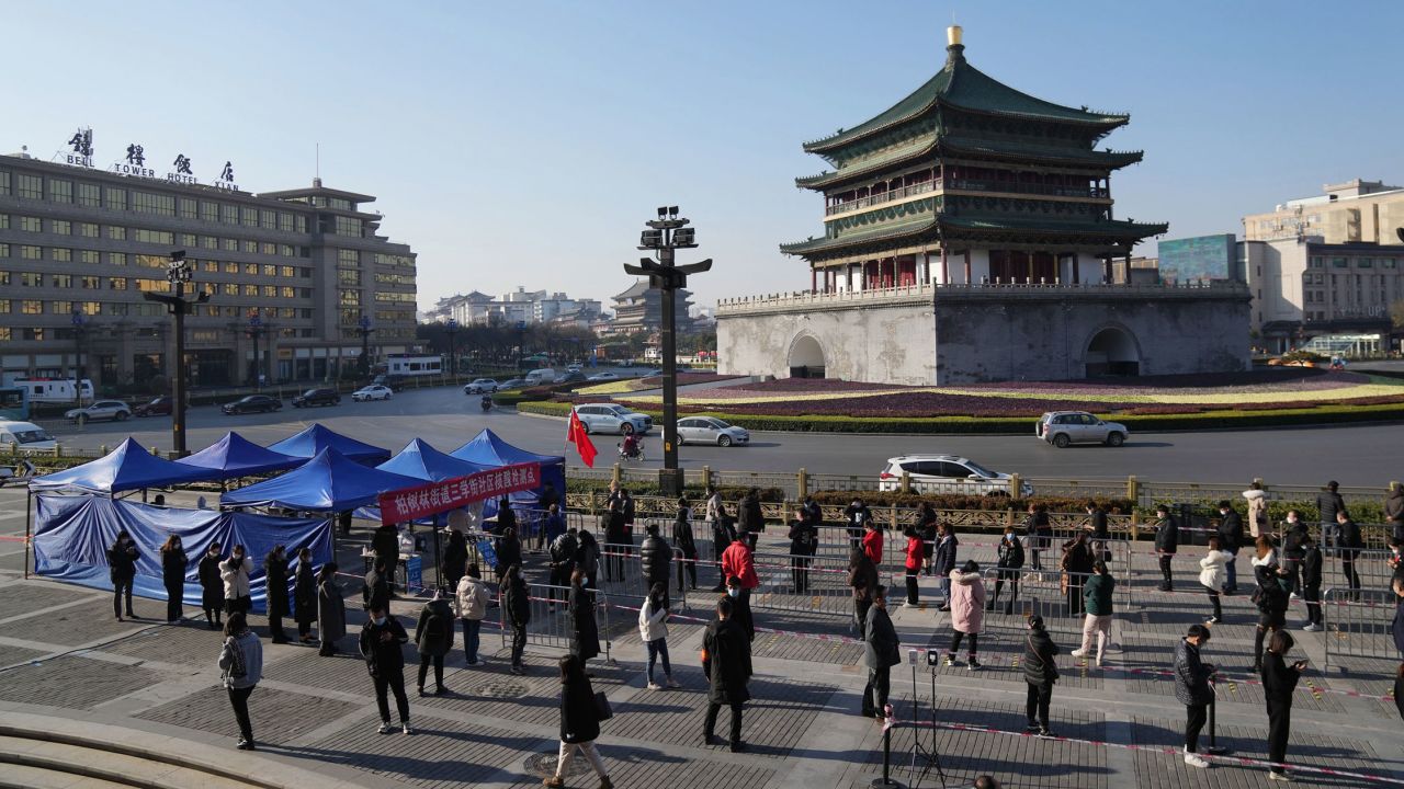 Residents queue up for Covid tests at a testing site in Xi'an, China, on December 21.