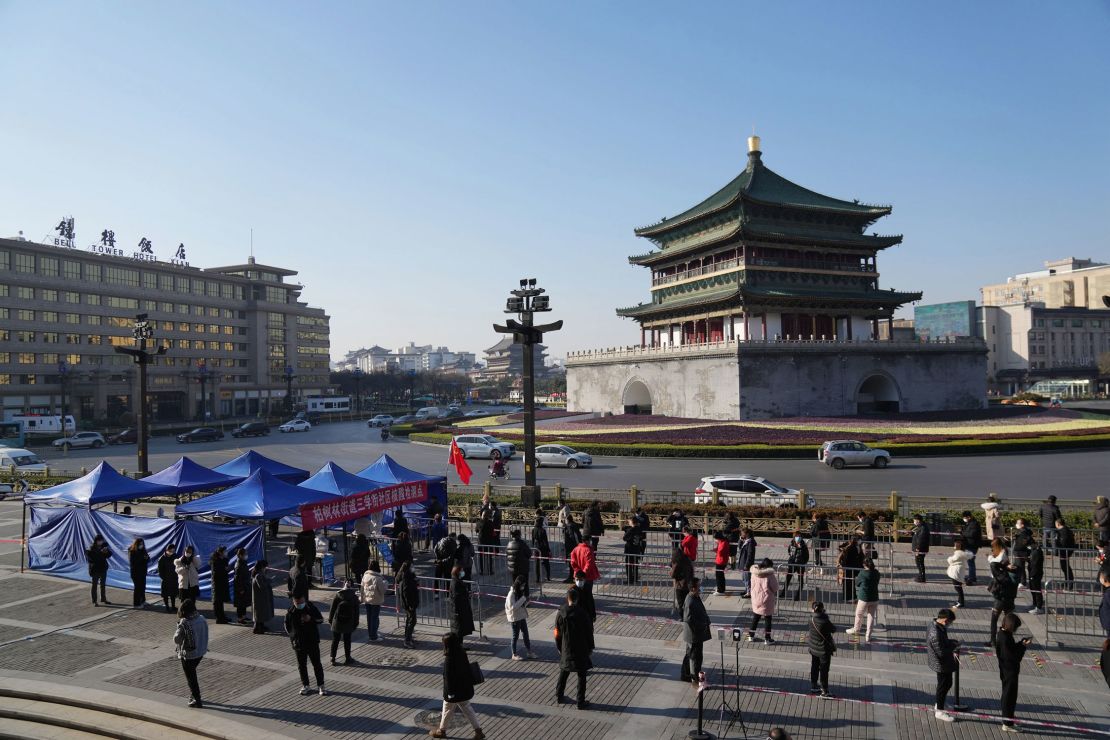 Residents queue up for Covid tests at a testing site in Xi'an, China, on December 21.