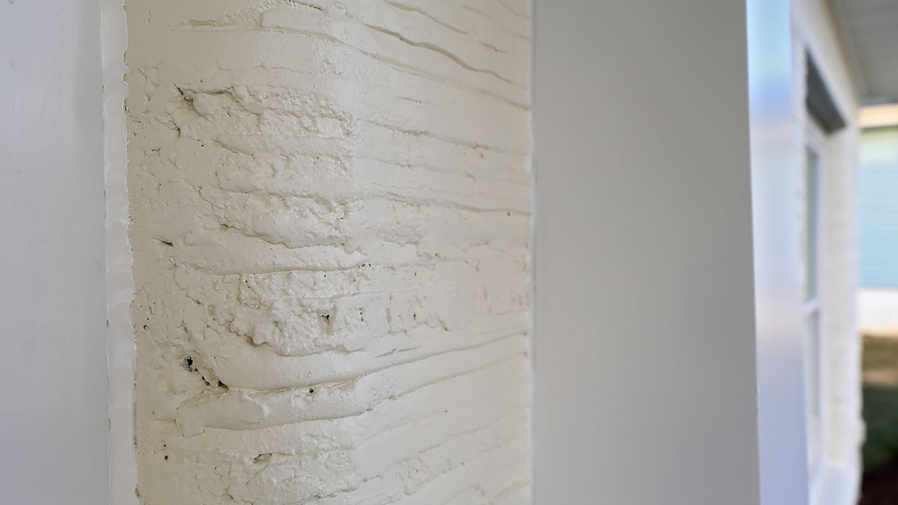 The concrete exterior of the new Habitat for Humanity 3D printed house.