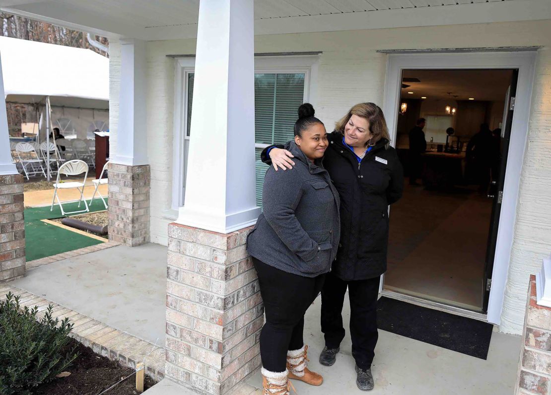 Janet V. Green, right, welcomes April Stringfield, left, to her new home.