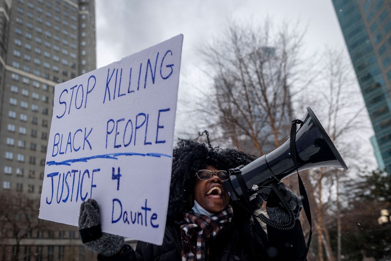 Ashley Dorelus demonstrates outside the Hennepin County Government Center in Minneapolis on December 21 during <a href="https://www.cnn.com/2021/12/22/us/kim-potter-trial-wednesday/index.html" target="_blank">jury deliberations</a> in the trial of former police officer Kim Potter. Potter was found guilty of manslaughter Thursday for fatally shooting Daunte Wright during a traffic stop in April. She testified the shooting was an accident and that she mistakenly grabbed her gun instead of her Taser. 