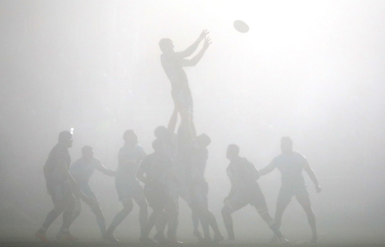 The Glasgow Warriors and Exeter Chiefs compete in the fog during the Heineken Champions Cup rugby match at Scotstoun Stadium in Glasgow, Scotland, on December 18.
