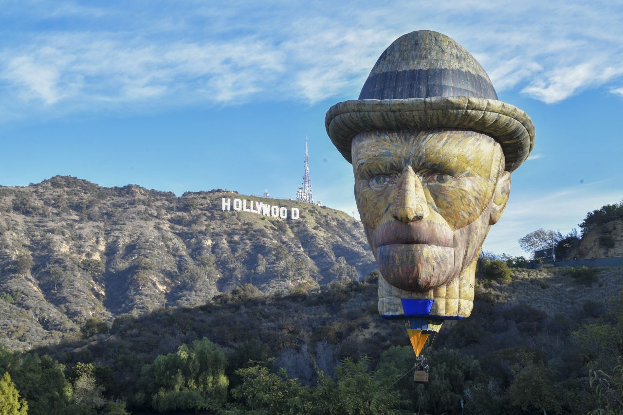 Lighthouse Immersive's 92-foot-tall Vincent Van Gogh-shaped hot air balloon is launched at Lake Hollywood Park in Los Angeles on December 20.