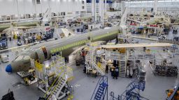 An Airbus A220 plane at the Airbus Canada LP assembly and finishing site in Mirabel, Quebec, Canada, on Wednesday, Nov. 17, 2021. Air Lease Corp. is seeing demand for single-aisle jets like Airbus SE's A320neo and A220 families outstrip the planemakers' current rates of manufacturing. Photographer: Graham Hughes/Bloomberg via Getty Images