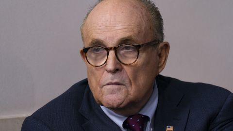 Rudy Giuliani, personal lawyer to US President Donald Trump, listens as then-President Donald Trump speaks during a news conference at the White House in Washington, DC, on Sunday, Sept. 27, 2020.