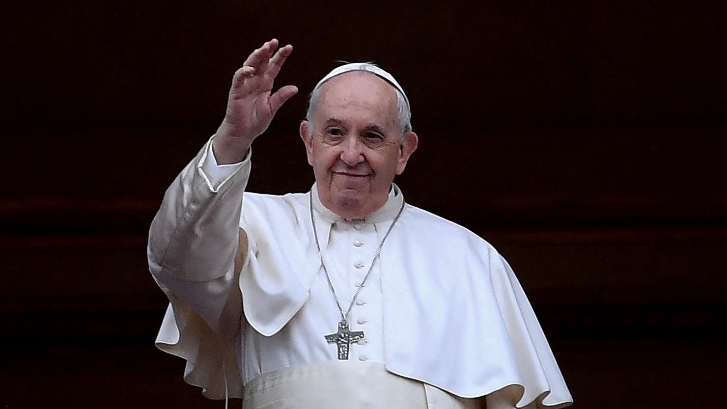 Pope Francis waves following his Christmas blessing in St. Peter's Square on December 25, 2021. 