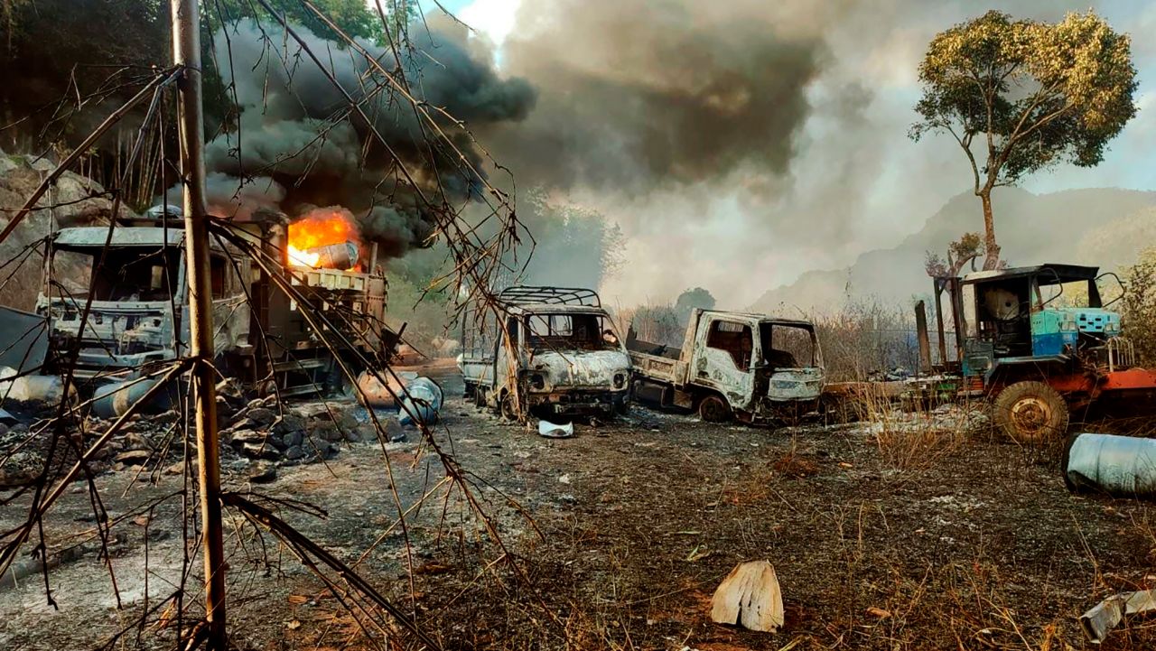 In this photo provided by the Karenni Nationalities Defense Force (KNDF), smokes and flames billow from vehicles in Hpruso township, Kayah state, Myanmar, Friday, Dec. 24, 2021. Myanmar government troops rounded up villagers, some believed to be women and children, fatally shot more than 30 and set the bodies on fire, a witness and other reports said Saturday.