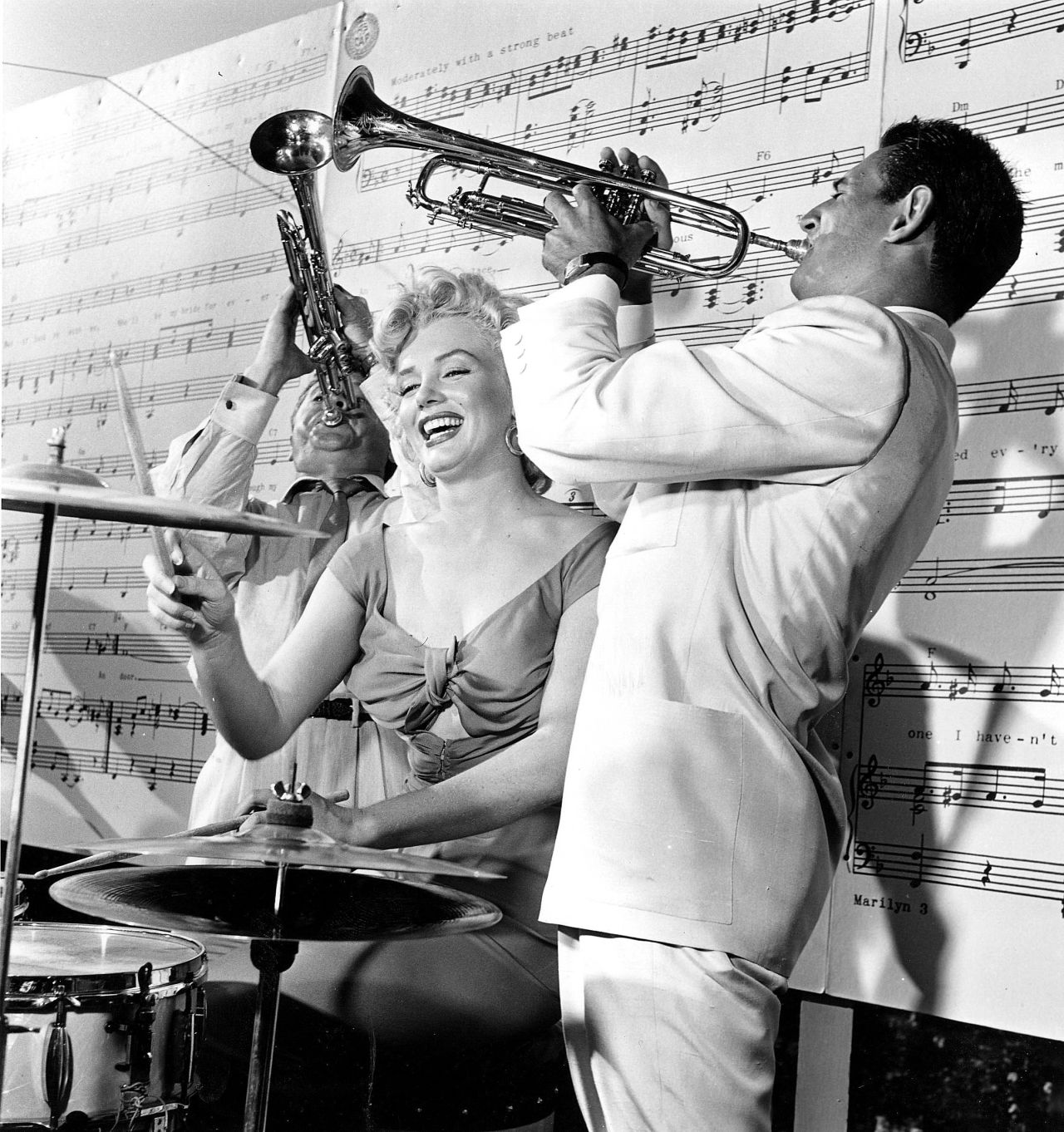 By the 1950s, Monroe was a household name. In 1953, she made history by becoming the first cover and centerfold of "Playboy" magazine. In this photo, Monroe is playing the drums with the Ray Anthony Band.
