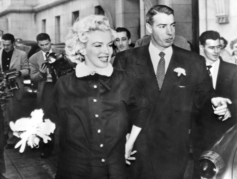 Monroe and former Yankees baseball player Joe DiMaggio leave city hall after their wedding. After two years of dating, their marriage captivated the nation in 1954. 