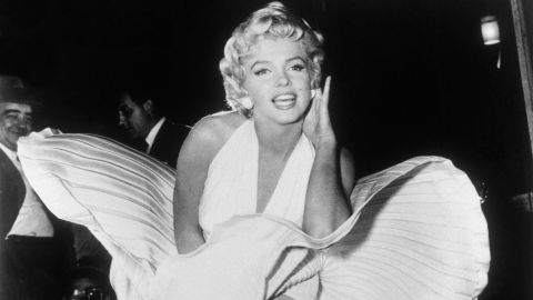 This is <a href="https://www.cnn.com/style/article/marilyn-monroe-white-dress-remember-when/index.html" target="_blank">the most iconic image </a>of Monroe's career. While filming for "The Seven Year Itch" in New York, she posed over a subway grate as the breeze sent her dress flying. The crowd shouted "higher" each time a blast of wind lifted her dress. It took 14 takes and the scene was later re-shot at a studio lot in California. <br /><br />"We thought it would be over in a minute and a half.  It was two hours of craziness," said Amy Greene, Monroe's friend, who was at the New York shoot. 
