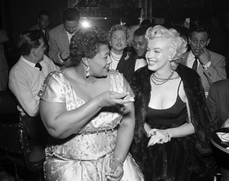 Monroe is seen with singer Ella Fitzgerald at the Tiffany Club in Hollywood, California, in 1954. 