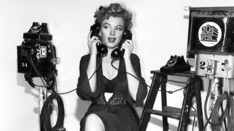 Holding two telephones, Monroe poses at the 20th Century Fox film set. In 1956, she starred in the drama "Bus Stop." She played a saloon singer with an Ozark accent. "She did the hardest thing to do. She chose to play it like somebody who is not very good at what they do but trying really hard to be good," said actress Ellen Burstyn. 