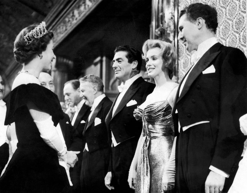 Queen Elizabeth II meets Monroe at the Royal Command Film Performance in London in 1956. Monroe went to England to film 