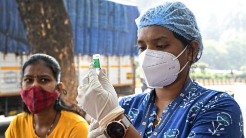 A health worker prepares a dose of the Covishield vaccine in Mumbai, India, on December 22.