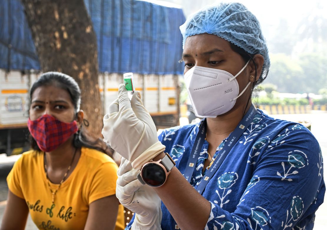 A health worker prepares a dose of the Covishield vaccine in Mumbai, India, on December 22.