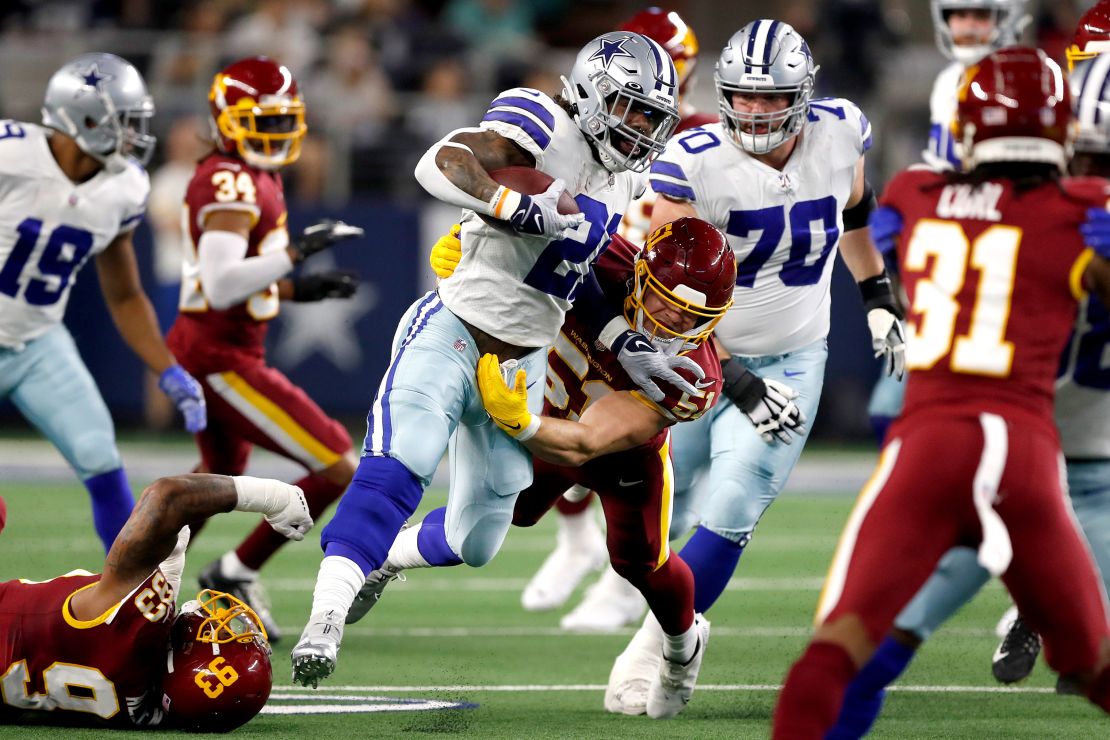 Ezekiel Elliott #21 of the Dallas Cowboys rushes with the ball during the first half.