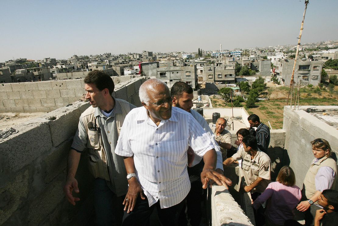 Desmond Tutu, center, visits a house in the town of Beit Hanun in the northern Gaza Strip on May 28, 2008.