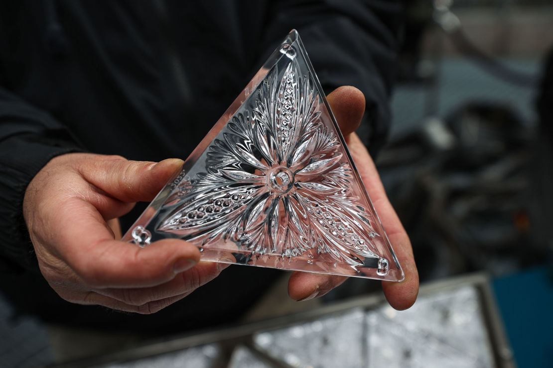 A close-up shot of a crystal triangle about to be placed on the New Year's Eve ball.