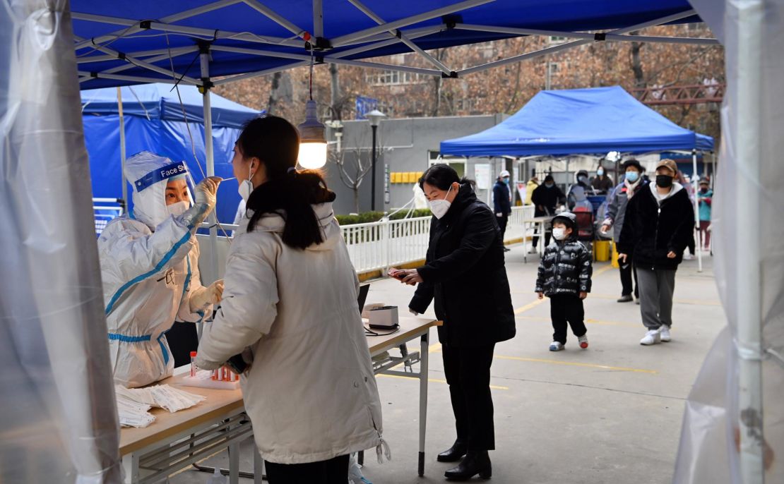 Residents take nucleic acid tests in Xi'an on December 27, during a city-wide lockdown.