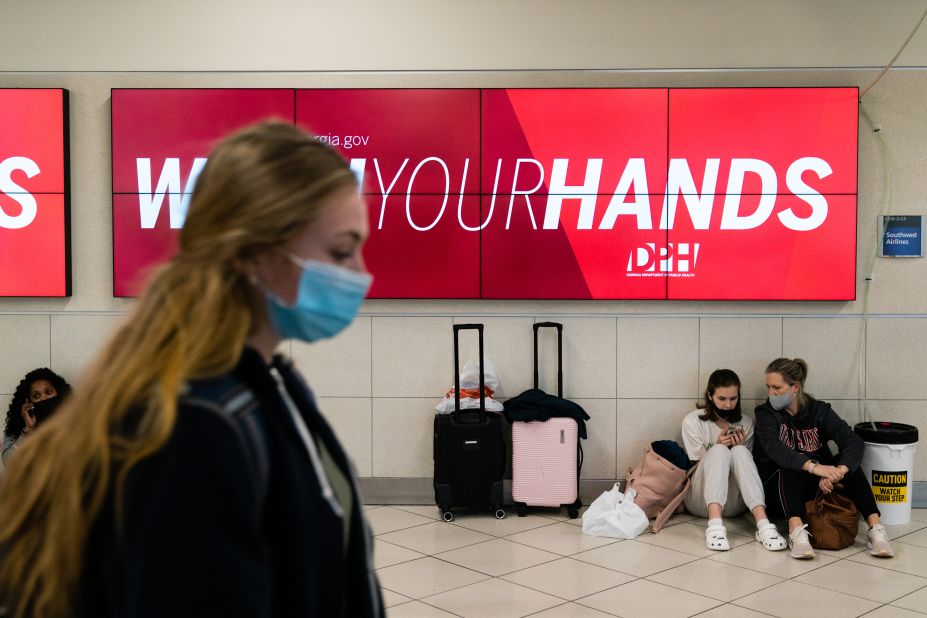A digital billboard encourages travelers to wash their hands at Atlanta's international airport on Monday, December 27.