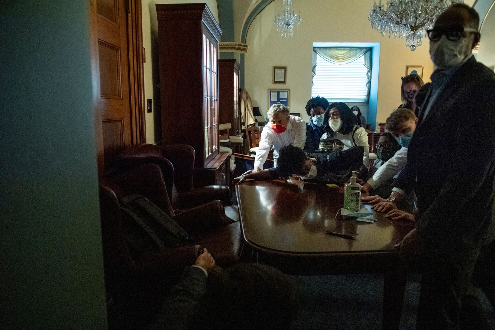 Congressional staffers put up a barricade inside the Capitol after the building was breached.