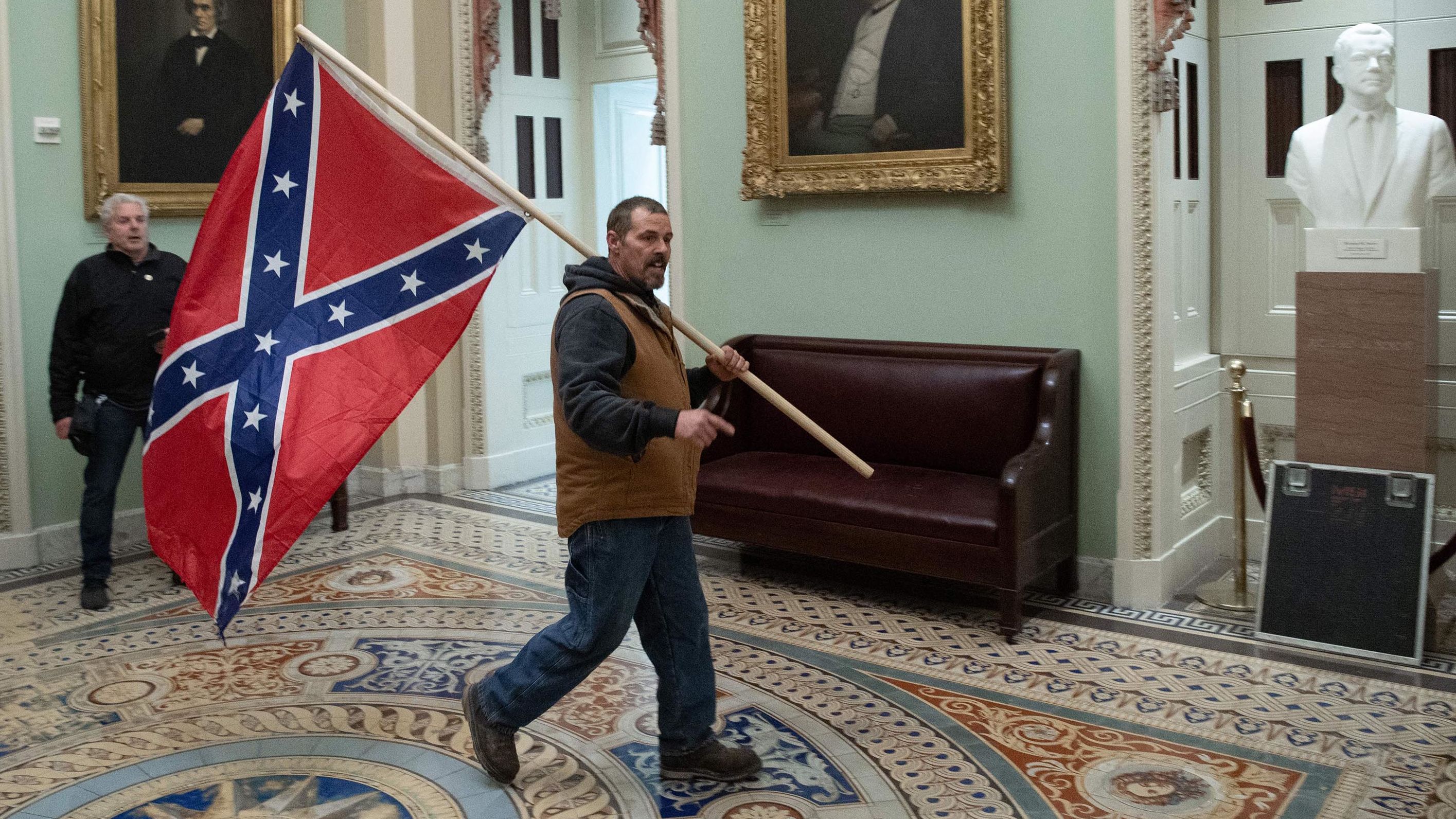 A Trump supporter <a href="https://www.cnn.com/2021/01/07/us/capitol-confederate-flag-fort-stevens/index.html" target="_blank">carries a Confederate battle flag</a> in the Capitol Rotunda after rioters breached the building. During the Civil War, the closest any insurgent carrying a Confederate flag ever came to the Capitol was about 6 miles, during the Battle of Fort Stevens in 1864.